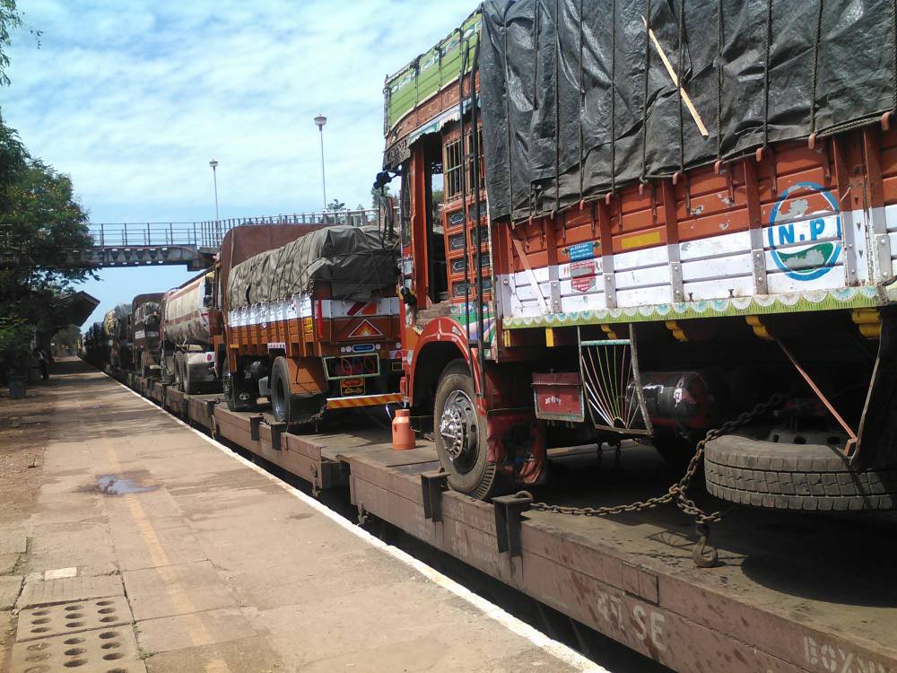 Trucks loaded on train