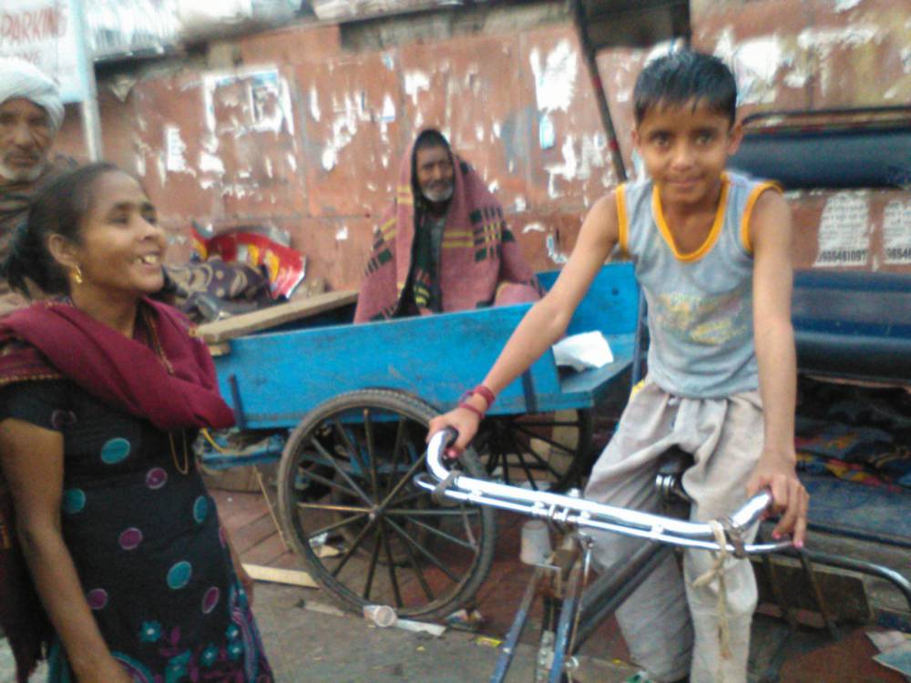 Mom watches son showing off that he's ready for the family business
